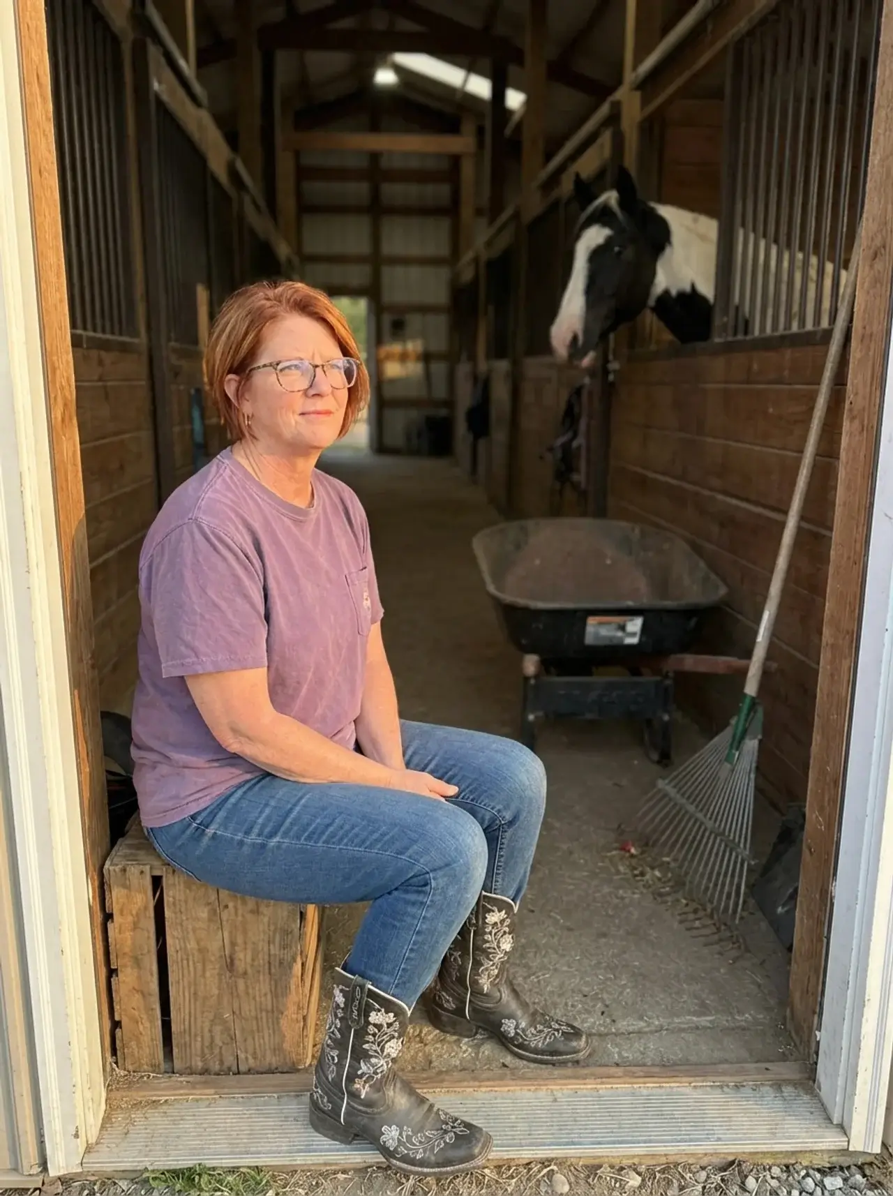 Christy Taylor in barn doorway with paint horse